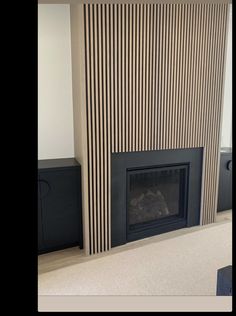 a living room with a fire place and tv on the wall next to it's fireplace