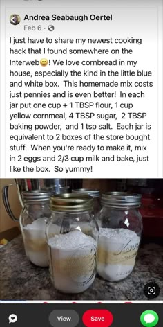 three jars filled with white sand sitting on top of a counter