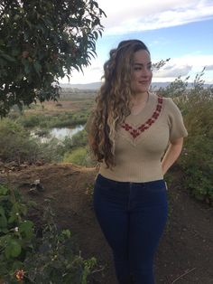 Beige sweater top, v-neck, with flowers on chest. The top fits a small to medium, and has stretch. This1970stop will look cute with a pair of bellbottom pants, or a corderoid skirt. We at AzucarSugar arehappy to have this funky blouse in our AzucarSugar boutique. . . . . . . . . . . . . . . . . . . #hippy #hipster #costume #fashion #1970s #70s #funky #top #blouse #shirt #fashionable #stretch #comfortable #stretchy #brown Vintage Stretch V-neck Top, Retro V-neck Stretch Top, Fitted Cotton V-neck Sweater, Fitted Knit V-neck Top, Retro Cotton V-neck Tops, Vintage Beige V-neck Top, Retro Stretch V-neck Top, Beige Knit Retro Top, Fitted Cotton V-neck Sweater For Spring