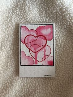 a piece of paper that has some kind of heart drawn on it with red ink