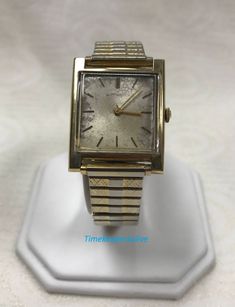 "PLEASE READ ENTIRE DESCRIPTION BEFORE PURCHASING Vintage Original Wittnauer Gold Tone 14K Gold filled 17 J Mechanical Wrist Watch Pre-owned: Some scratches from normal wear, appropriate to its age. Face shows some discoloration. Please see photos for details. Watch is working and keeping time well. Watch is in great mechanical condition, all of our watches are tested for time by one of our watchmakers before being listed for sale. Specifics: *Wittnauer *Mechanical(hand-winding) *14K Gold Filled Mechanical Hand, Authentic Watches, Filigree Ring, Square Watch, Saint Louis, Wristwatch Men, Wrist Watches, Metal Bands, Time Piece