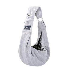 a gray sling bag with black and white checkered fabric on the front, hanging from an adjustable strap