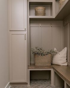 an image of a closet with baskets on the shelves