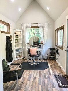 a room with wooden floors and white walls