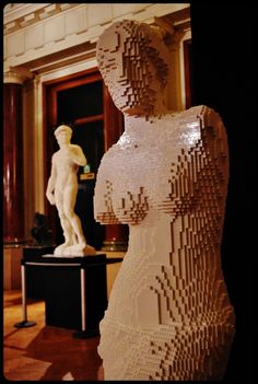 a statue made out of legos in a room