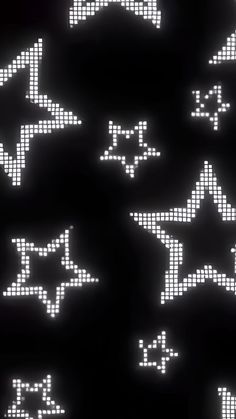 an array of pixelated stars on a black background