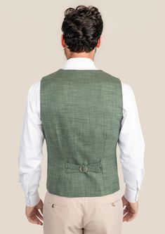 Take on the world with confidence in our Aspen Green Hopsack Vest. Custom made from a luxurious bamboo/wool/linen/silk blend by Cavani, this vest will have you standing out in any crowd. Experience the thrill of effortless style while making a bold statement. Eye-catching and daring, this vest is for the fashion-forward individuals. Sage Green Vest, Luxury Green Men's Vest, Military Style Green Sleeveless Vest, Green Military Sleeveless Vest, Khaki Military Sleeveless Vest, Suit Guide, Vest And Tie, Linen Suits, Cotton Blazer