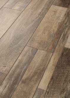 wood flooring that looks like it has been made from different types of boards and planks