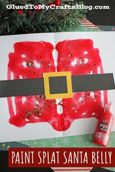 santa's belt made out of paper and glue on top of a christmas card