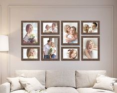 a living room filled with white furniture and pictures on the wall above it's coffee table