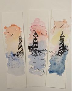 three watercolor cards with lighthouses on them