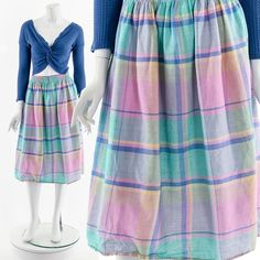 - 80s pastel rainbow madras skirt - elastic waist - pockets on side seams - knee length Fits like:  S - M Material:  Cotton Condition:  Great Clipped on Mannequin:  No ✂ SIZE + FIT ✂ Length: 28" / 71 cm Waist: 26" to 34" / 66 cm to 86 cm Hips: 54" / 137 cm All measurements are taken with garment lying flat. ALWAYS refer to measurements as vintage sizes can vary greatly from today's modern sizes. We recommend comparing measurements above with a similar style garment you own for best fit before pu Casual Multicolor Knee-length Bottoms, Plaid Knee-length Skirt For Summer, Plaid Knee-length Summer Skirt, Multicolor Knee-length Cotton Skirt, Madras Plaid Dress, Madras Checks Dress, Multicolor Cotton Knee-length Skirt, Retro Multicolor Rainbow Print Top, Madras Checks