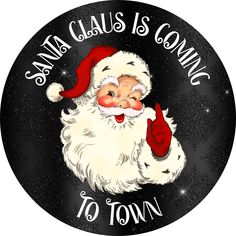 santa claus is coming to town sticker on a black background with stars and snowflakes