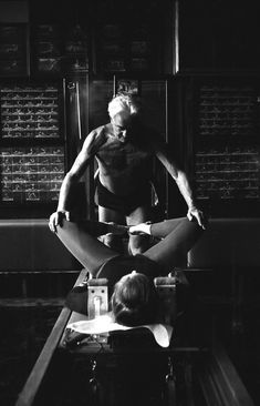 a man doing yoga in front of a brick wall with the words six pilates principals