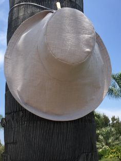 Natural Linen Sun Hat Wedding Hat Wide Brimmed Sun Hat Elegant Sunhat Large Brim by Freckles Califor Elegant Curved Brim Hat, Classic Flat Brim Bucket Hat For Beach, Classic Flat Brim Bucket Hat For The Beach, Classic Beige Cloche Hat With Flat Brim, Beige Wide Brim Boater Hat, Classic Beige Brimmed Sun Hat, Classic Wide Brim Sun Hat, Beige Flat Brim Sun Hat For Wedding, Elegant Solid Panama Hat With Wide Brim