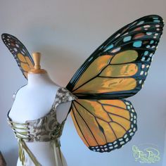 a dress form with a butterfly on it