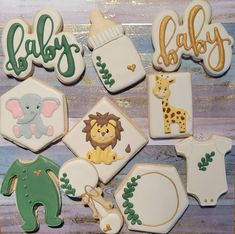 baby shower cookies decorated to look like animals, giraffes and other items