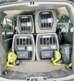 the back end of a car with four seats in it and three buckets on the floor