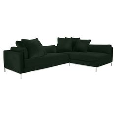 a black sectional couch with pillows on the top and bottom corner, in front of a white background