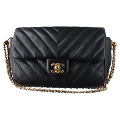 Chanel Classic Flap Mini Chevron Quilted Chain Around Mini Rectangular Flap Black, 2018 Crafted from genuine lambskin leather, this CHANEL Classic Flap Mini Chevron Quilted Chain Around Mini Rectangular Bag in Black exudes chic charm. The chevron quilting adds texture to the black exterior, while the aged gold crossbody shoulder chain, wrapped in grey undertones leather, gives the bag a luxurious touch. Complete with a matching aged gold Chanel CC turn lock, the bag opens to a coordinated interior with a convenient zipper pocket. CONDITION: VERY GOOD This previously owned and used item is in good condition with some signs of use. Light scratches to the hardware, light creases on the leather. Scrapping to the leather and chain on the bottom. DETAILS: circa 2018 Series 25 Classic Flap Lambsk Luxury Rectangular Bag With Multiple Pockets, Gold Chanel, Chevron Quilt, Shoulder Chain, Black Exterior, Classic Flap, Lambskin Leather, Fashion Handbags, Chanel Classic Flap