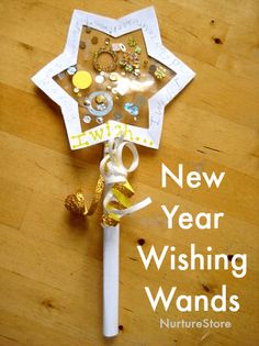 a white and gold umbrella on top of a wooden floor next to a bottle opener