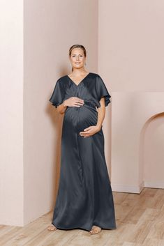 Our graceful Gwen Satin dress has been modified with a higher waistline and extra room to accommodate a growing bump, becoming the perfect option for the mommy-to-be in your bridal party! While a little more modest in coverage, the Gwen still features flutter sleeves and a delicate front twist detail that adds sophistication to a timeless design. FEATURES: Empire silhouette V-neckline Built-in bra cups and vertical boning for support Dolman flutter sleeves Back zipper Full-length double lining f Elegant V-neck Maternity Gown, Elegant Nursing Friendly V-neck Dress, Elegant Maternity Dress Nursing Friendly, Elegant Nursing-friendly Maternity Dress, Elegant V-neck Maternity Dress Nursing Friendly, Elegant Maternity Maxi Dress With Short Sleeves, Elegant Short Sleeve Maternity Maxi Dress, Elegant Maternity Gown With V-neck, Elegant Maternity V-neck Gown