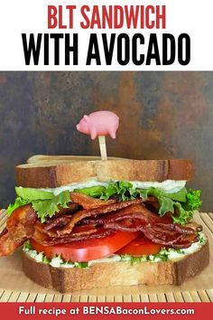 a sandwich with bacon, lettuce and tomato on it that says blt sandwich with avocado