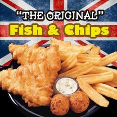 fish and chips on a black plate with the british flag in the backgroud