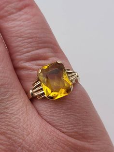 Vintage 10k Yellow Gold Fancy Emerald Cut Yellow Glass Ring, This stunning ring is perfect for anyone looking for a classic and elegant accessory that is sure to turn heads. Its timeless design and high-quality construction ensure that it will be cherished for years to come.  Size 6 2.6 grams Cleaned and polished to newer condition. marked 10k Welcome to Westgate Jewels! At Westgate Jewels, we specialize in vintage estate jewelry, vintage designer jewelry, Vintage Native American jewelry and wea Yellow Stone Ring, Yellow Stone Rings, November Birthstone Ring, Vintage Native American Jewelry, Vintage Designer Jewelry, Glass Ring, Yellow Stone, November Birthstone, Glass Rings