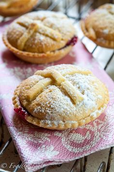 several pastries are sitting on a pink napkin