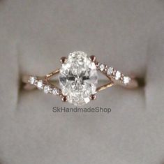 an oval shaped diamond ring with diamonds on it