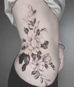 a woman's stomach with flowers on it