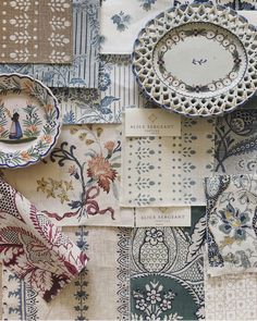 an assortment of plates and napkins are arranged on top of each other in different patterns