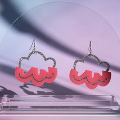 Say hello to Chroma Cloud: your new favorite lightweight earrings. These dreamy pink and silver cloud earrings are the perfect way to make sure you're having a good day, no matter what happens. Made from sparkly silver and pink acrylic, these earrings are finished with nickel-free sterling silver fill ear wires, so you can rock these babies without worrying about metal allergies or skin irritation. Trendy Hypoallergenic Pink Earrings, Trendy Pink Hypoallergenic Earrings, Trendy Pink Earrings, Trendy Pink Sterling Silver Earrings, Whimsical Pink Nickel-free Earrings, Cheap Pink Star-shaped Earrings, Rain Cloud Earrings, Playful Pink Resin Earrings, Pink Heart-shaped Adjustable Earrings