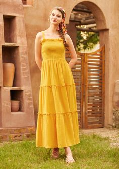 Embrace the warmth of the sun in this mustard yellow tiered maxi dress, another gem from our ModCloth namesake label. Sleeveless and serene, this dress cascades effortlessly down in beautiful tiers, creating a dance of light and fabric with every move you make. Ideal for balmy day ventures or serene evening soirees, its vibrant color brings a cheerful aura wherever it goes. Its airy, breathable fabric ensures endless comfort, making it a perfect companion for leisurely walks or sophisticated gatherings under the open sky. 100% Cotton Machine wash cold, line dry Imported Model 1 is wearing a US size S Model Measurements: Height 5'7"/ Bust 33''/ Waist 24''/ Hips 35'' | ModCloth Glimmering Goddess Maxi Dress in Gold Nugget Yellow Boho Dress, Goddess Maxi Dress, Open Sky, Dress Aesthetic, Gold Nugget, Tiered Maxi Dress, S Models, Mustard Yellow, Boho Dress