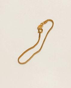 The slinkiest and daintiest bracelet that you can wear every day for that barely-there look. Featuring a 2mm width 18k gold-filled snake chain that can easily be stacked. Tarnish-resistant, showerproof, and safe for sensitive skin. …………………………………. D E T A I L S • Snake chain width measures 2mm• Snake chain length measures 6.5"/16.5cm• Spring clasp• Tarnish-resistant, waterproof, and safe for sensitive skin • 18K Gold Filled Minimalist Snake Chain Bracelet With Lobster Clasp, Tarnish Resistant Snake Chain Bracelet, Adjustable Dainty Snake Chain Bracelet, Dainty Adjustable Snake Chain Bracelet, Everyday Adjustable Snake Chain Bracelet, Adjustable Snake Chain Bracelet, Gold Snake Chain Bracelet With Adjustable Chain, Minimalist Snake Chain Bracelet With Adjustable Chain, Gold Plated Snake Chain Bracelet