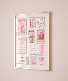 a pink and gold framed wall hanging on the side of a wall