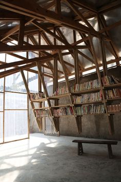 the bookshelf is made out of wooden beams