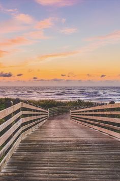 Wooden boardwalk leads down to a beautiful beach at sunset. Cinnamon Shore Texas, Port Austin, 2024 Manifestation, Texas Vacation