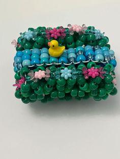 a bunch of beads with a rubber ducky on it