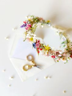 Wild flowers hair crown in meadow style. Perfect for weddings or proms and other special events. The flower crown is made of artificial and preserved flowers and other trinkets used for arranging.  SMALL BOUQUET: https://www.etsy.com/uk/listing/1676614854/small-summer-bouquet-flower-bouquet-for?click_key=32b1592cfd3cc8548476fe015f8cf4360d73029b%3A1676614854&click_sum=f0e28b1c&ref=related-4&sts=1 MEDIUM BOUQUET: https://www.etsy.com/uk/listing/1676592490/boho-summer-bouquet-bridal-flower?click_ke Flowers Headpiece, Wildflower Crown, Flower Wreath Hair, Flower Veil, Wedding Hair Wreath, Bride Crown, Flower Wreaths, Flower Girl Crown, Hair Crown