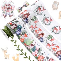 three rolls of decorative tape with animals and trees on them, one roll is white