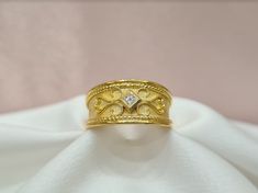 Handmade 18K solid yellow gold mat and shiny Byzantine ring with a diamond in the middle. It can be personalised for any ring size. With the ring you will receive an official gemological certificate! ❥ Free Express International Shipping ❥ Free Return within 5 days from the receiving day in case the jewel does not correspond to our site description. Features * Material: 18K Solid Yellow Gold * Gem Stones: 0.08ct Diamond * Ready to Ship in 1-3 Business Days ❥ Safety My jewellery are made ONLY for Byzantine Ring, Christian Ring, Byzantine Rings, Byzantine Jewelry, Greek Ring, Expensive Rings, Greek Design, Ring With Diamond, Gem Stones