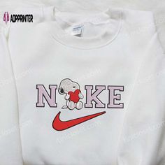 Introducing the Nike x Snoopy Heart Embroidered Sweatshirt, a delightful collaboration that brings together the iconic Nike brand and the Customized Nike Crewneck, Nike Crewneck Sweatshirt Diy, Snoopy Embroidered Sweatshirt, Diy Nike Sweatshirt, Nike Embroidery Sweatshirt, Snoopy Heart, Snoopy Sweatshirt, Nike Inspired, Nike Crewneck Sweatshirt