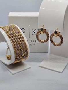 Handmade set of beaded bracelet and earrings made with Japanese 24K Gold-plated Miyuki Delica beads. 💎A beautiful sparkling jewelry, stylish and fashionable. It will suit both the holiday under an elegant dress and the office under a strict suit. In my brand's jewelry, you will be the center of attention in any situation and in any case. 🎁Also,my jewelry is perfect for a gift to loved ones and important people for you,as they are sent in gift wrapping. 💎Miyuki Delica are high quality Japanese Earrings Cuff, Sparkling Jewelry, Miyuki Bracelet, Seed Bead Bracelet, Small Beads, Bracelet Dainty, Sparkle Jewelry, Beaded Cuff, Bridesmaid Bracelet