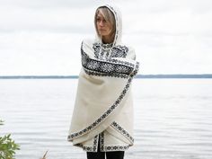 Warm and cozy poncho on the frog closures. Available in White color with black pattern and in white color with light gray pattern. One size: length 82 cm / 32 inches I will contact you to clarify your height to be sure the poncho will be perfect for you.   All products are made in Estonia out of lambswool. It has the best possible quality.  I make exclusive woolen products made on the basis of the national traditions of Scandinavia and the Nordic countries. This product is soft and warm. Perfect White Winter Poncho Cape, Cozy White Winter Cape, Fair Isle Flower, Knitting Patterns Hats Women, Nordic Countries, Ladies Poncho, Hat Knitting Patterns, Grey Pattern, Estonia