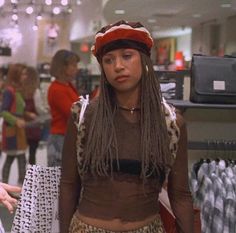 a woman with dreadlocks standing in a store