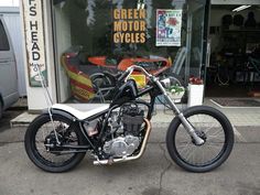 a motorcycle parked in front of a store