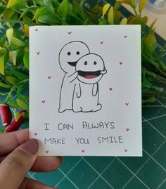 someone holding up a card that says i can always make you smile