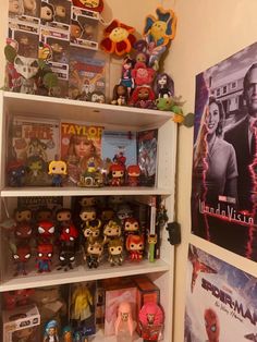 the shelves are filled with toys and movies